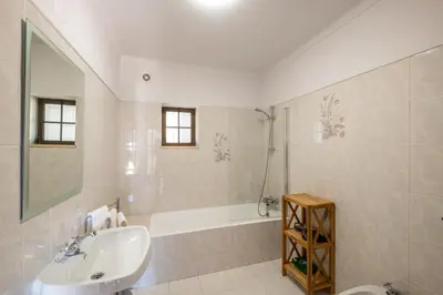 a white bathroom with a sink and a shower at Casa Katarina - Private Villa - Heated pool - Free Wifi - Air Con in Tunes