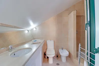 a bathroom with a toilet and a sink at Marina Princess in Vilamoura