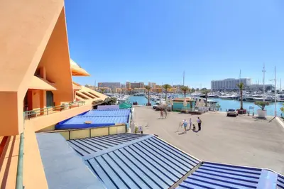 a view of a marina with people walking around at Marina Princess in Vilamoura