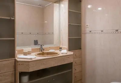 a bathroom with a sink and a shower at CAROB APARTMENT - BY MAYORAL (FALÉSIA BEACH) in Olhos de Água
