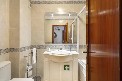 a bathroom with a sink and a mirror at Vilamoura - Cozy and Quiet Holiday Apartment in Vilamoura