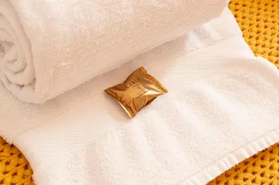 a gold pin sitting on top of a white towel at Greenth Avenue in Faro