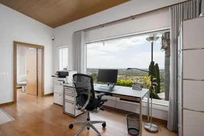 an office with a desk with a computer and a window at Villa Mebahel - Boliqueime in Boliqueime