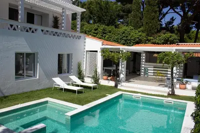 a swimming pool in the yard of a house at Algarve Beach House with Heated Pool and Jacuzzi in Albufeira