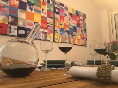 a table with glasses of wine on top of it at Algarve Beach House with Heated Pool and Jacuzzi in Albufeira
