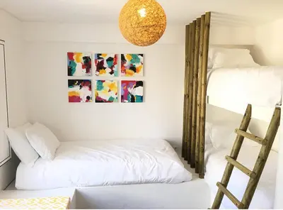 a room with two bunk beds and a ladder at Algarve Beach House with Heated Pool and Jacuzzi in Albufeira