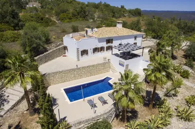 an aerial view of a house with a swimming pool at Villa Angel in Loulé