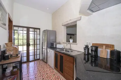 a bedroom with a bed with towels on it at Villa Angel in Loulé