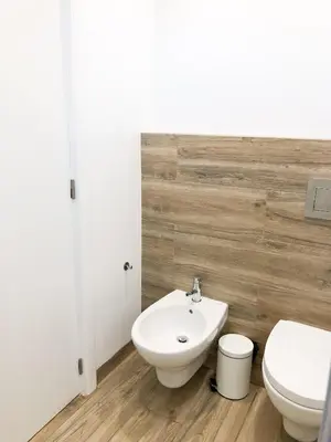 a bathroom with a white toilet and a sink at Vilamoura Marina Apartment with swimming pool in Vilamoura