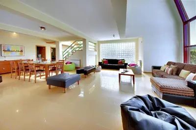 a living room filled with furniture and a table at Vila Marina -BBQ, pool & garden- by Seareen in Albufeira