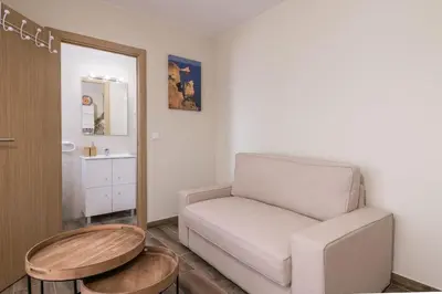 a living room with a couch and a table at LovelyStay - Sweet Escape I - Terrace in Quarteira