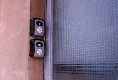 a close up of a door with a window at Surf Vibe Guest House in Faro