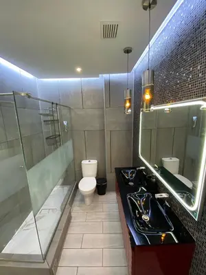 a bathroom with a toilet and a sink and a mirror at AL MMaria in Faro