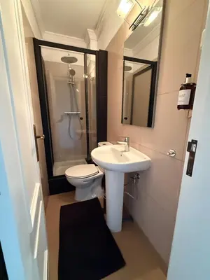 a bathroom with a sink and a toilet and a mirror at Dream House - Condominio com piscina aquecida e propriedade com 5 bicicletas incluindo 1 eletrica in Albufeira