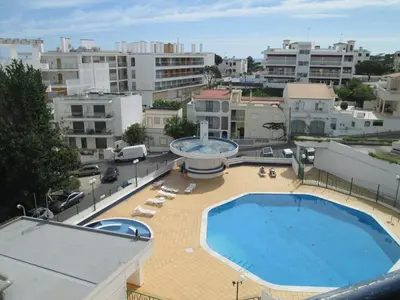 a swimming pool on the roof of a building at Naturmar Praia in Albufeira
