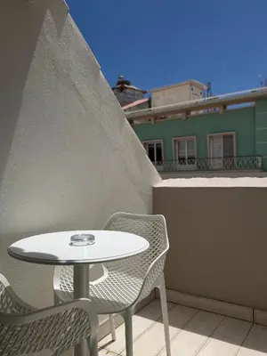 three bottles of sauce on a shelf with a box at Aqua Ria Boutique Hotel in Faro