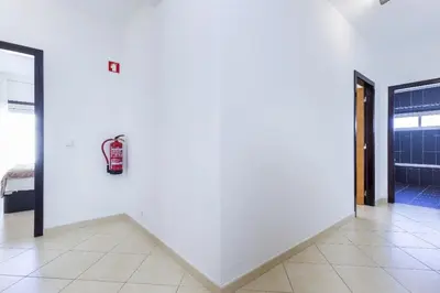 a room with a white wall with a fire hydrant on it at Cozy apartment in Albufeira 76 m² with lovely terrace in Albufeira