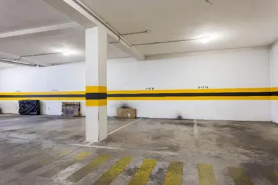 an empty room with yellow and white stripes on the walls at Cozy apartment in Albufeira 76 m² with lovely terrace in Albufeira