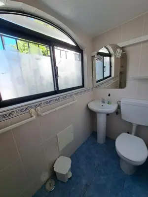 a bathroom with a sink and a shower at Villa Claramar in Albufeira