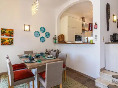 a kitchen and dining room with a table and chairs at Holiday Home Roberts by Interhome in Albufeira