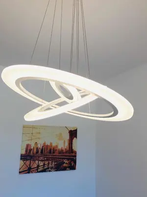 a white chandelier hanging from a ceiling at Golf Mar Village By Vilamoura Sun- Vista Golfe in Vilamoura
