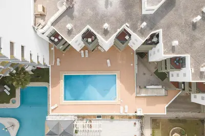 an aerial view of a building with a swimming pool at Algamar Apartment - Vilamoura Center in Vilamoura