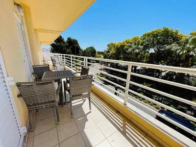 a balcony with chairs and a table on a balcony at Vilamoura Center - Near Marina By Vilamoura Sun in Quarteira
