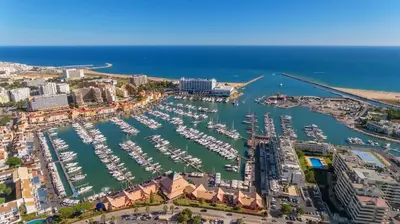 an aerial view of a harbor with boats at Vilamoura Center - Near Marina By Vilamoura Sun in Quarteira