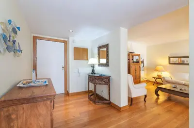 a living room with a couch and a table at Apartamento dentro da Marina de Vilamoura in Vilamoura