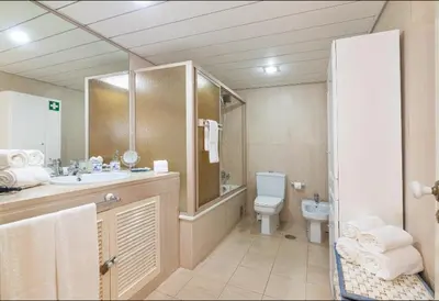 a bathroom with a toilet and a sink and a shower at Apartamento dentro da Marina de Vilamoura in Vilamoura