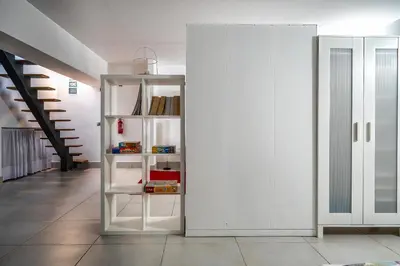 a white cabinet in a hallway next to a door at Townhouse 3 Bedroom Townhouse Olhos de Agua Communal pool AT03 in Olhos de Água