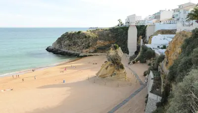 a view of a beach with people on the sand at Rossio in Albufeira
