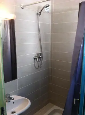 a bathroom with a shower and a sink at Rossio in Albufeira