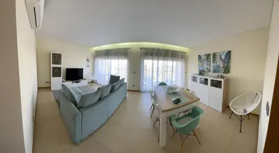 a hotel room with two towels on a bed at Albufeira Lux Apartment in Albufeira