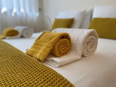 a living room with a couch and a table at Albufeira Lux Apartment in Albufeira