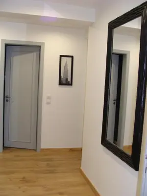 a mirror on a wall next to a hallway at Casa do Largo in Faro