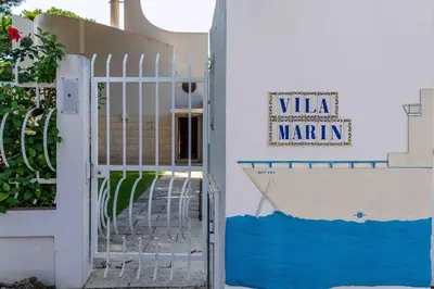 a gate to a building with a sign that reads villa marin at Luxury Villa 6 bedrooms with private pool in Vilamoura