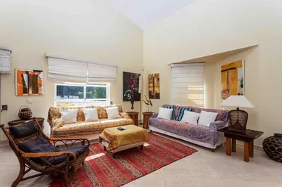 a large living room with a couch and chairs at Luxury Villa 6 bedrooms with private pool in Vilamoura