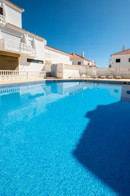 two men are flying in the air at #007 Foxy W by Home Holidays in Albufeira