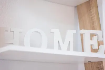 a white shelf with a sign that reads the main at #006 Foxy D by Home Holidays in Albufeira