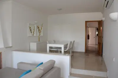 a living room with a couch and a table at Villa V2 X in Albufeira