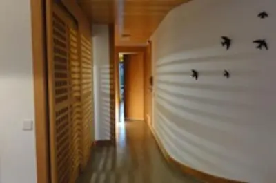 a hallway with bats on the wall of a house at 1Bed Apart Quinta do Lago in Almancil
