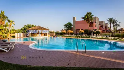 a large swimming pool with a gazebo in a resort at GREICE HOMES 2 BEDROOM LUXURY APARTMENT VICTORIA BOULEVARD in Vilamoura