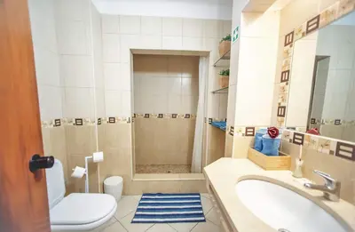 a bathroom with a sink and a toilet and a tub at Love Albufeira - Center, walk to the beach, Old Town, Oura Strip, top location in Albufeira