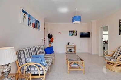 a living room with a couch and chairs and a table at Albufeira Concept 1 with Pool by Homing in Guia