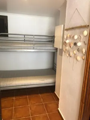 a room with a refrigerator with shells on it at Studio - Praia da Falesia - Algarve in Albufeira
