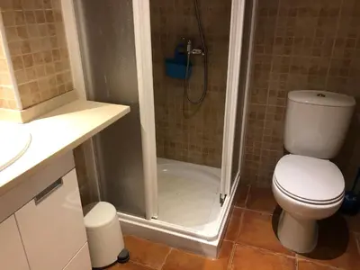a bathroom with a shower with a toilet and a sink at Studio - Praia da Falesia - Algarve in Albufeira
