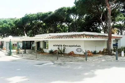 a building with a sign on the side of it at Studio - Praia da Falesia - Algarve in Albufeira