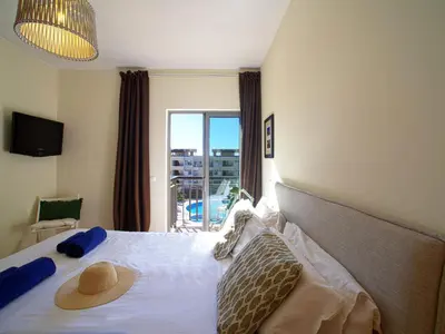 a bedroom with a bed with a hat on it at Apartment Vilas Mouriscas by Interhome in Vilamoura