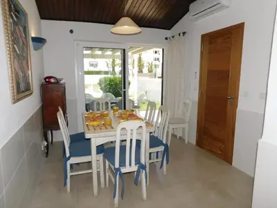 a living room with a couch and a flat screen tv at Estrela Mar Marina Villa in Quarteira